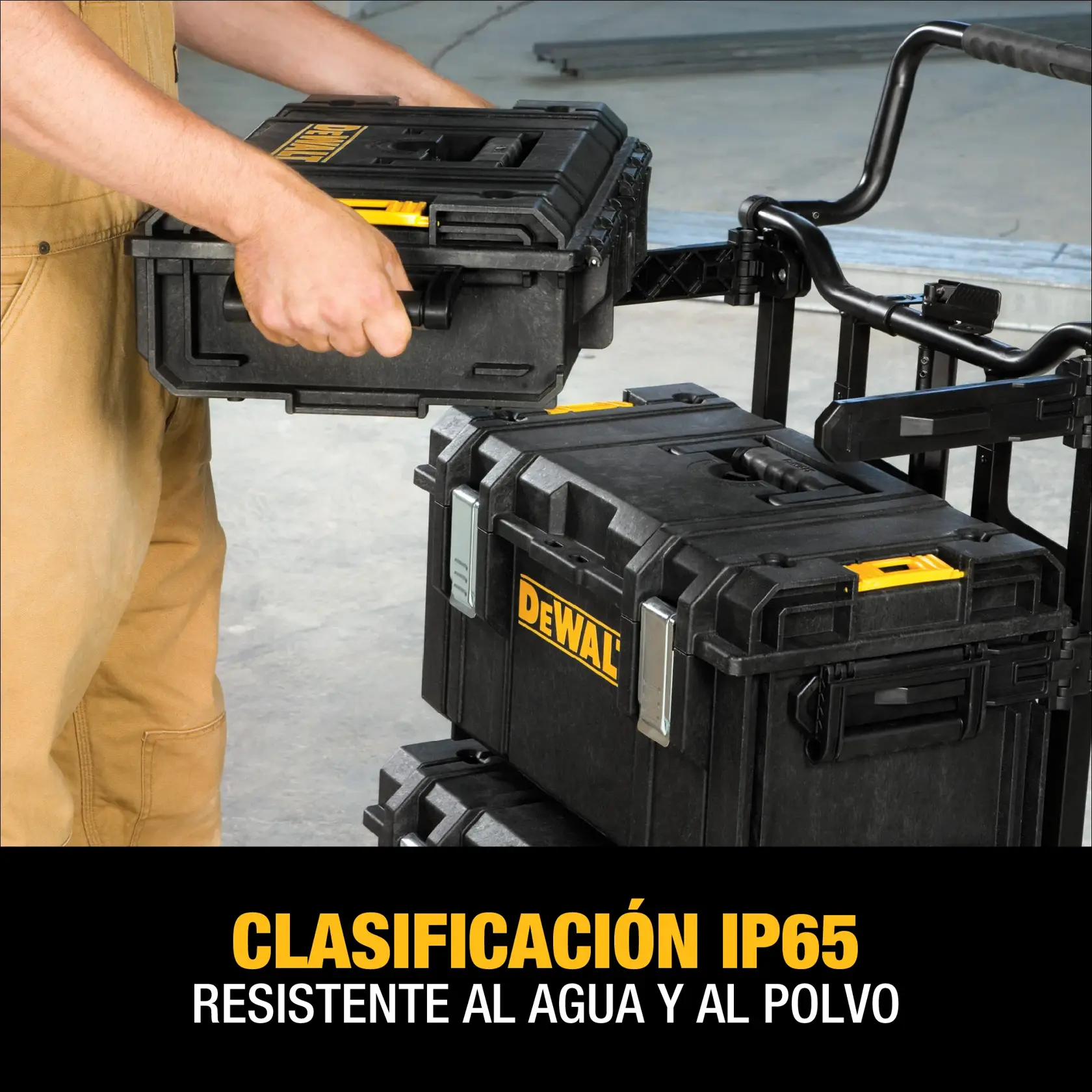 A person is handling a stackable DEWALT tool storage box on a worksite. The text below highlights IP65 rating, indicating resistance to water and dust.