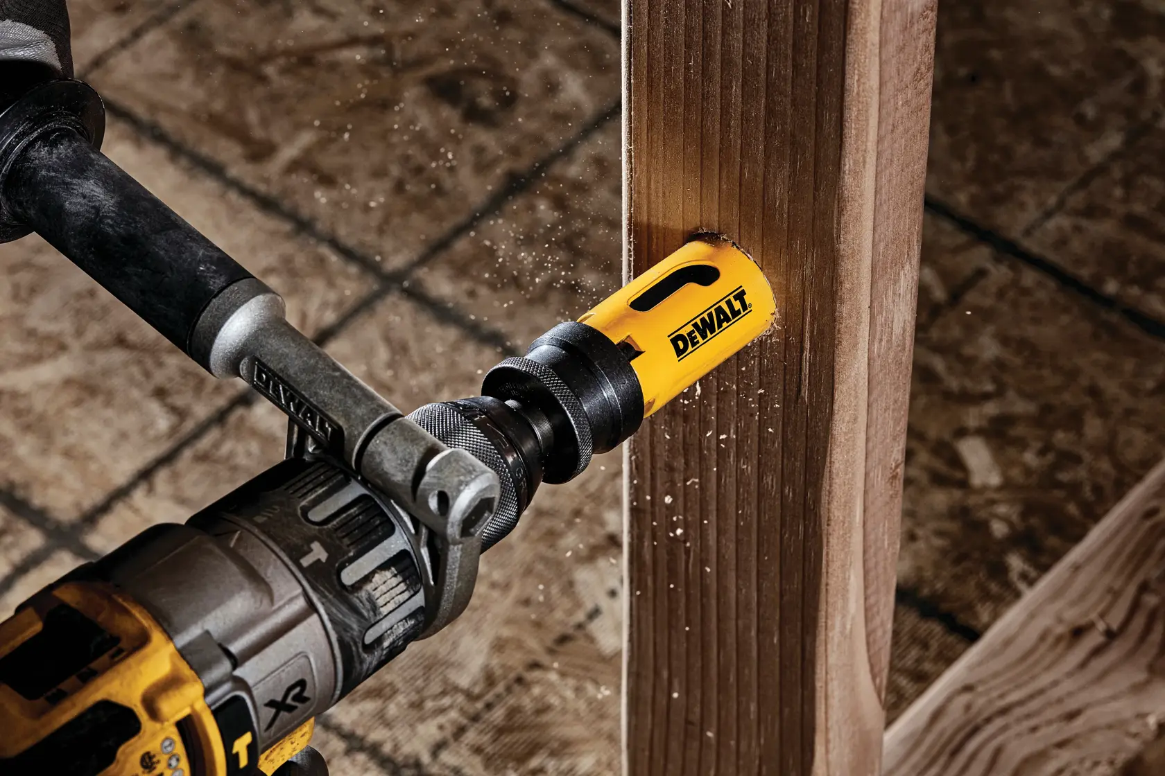 1 and 1 quarter inch Bi - Metal Hole Saw being used on a wooden structure.