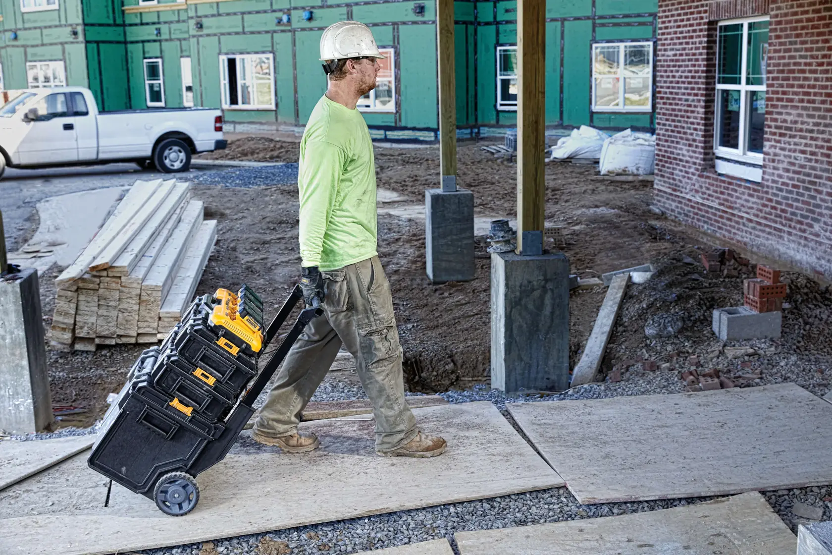 Multiport fast charger being taken to anor workspace by a construction worker