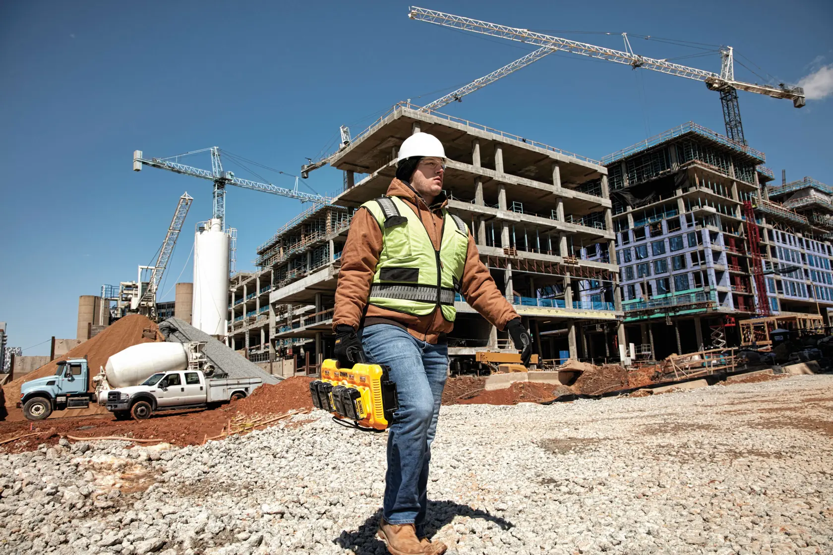 Multiport fast charger being carried by a construction worker