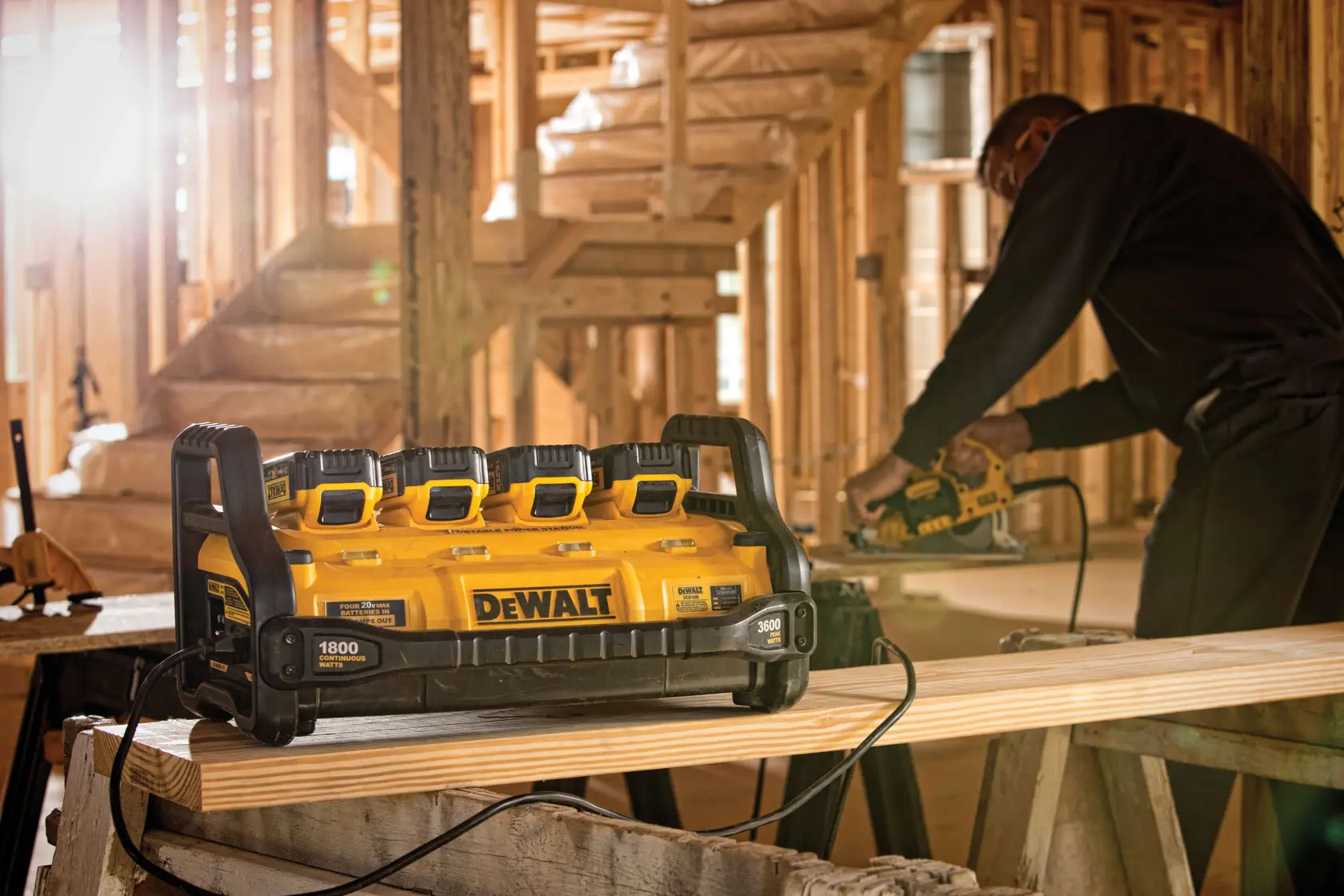 1800 Watt Portable Power Station and Battery Charger powering up a construction tool and charge four batteries simultaneously
