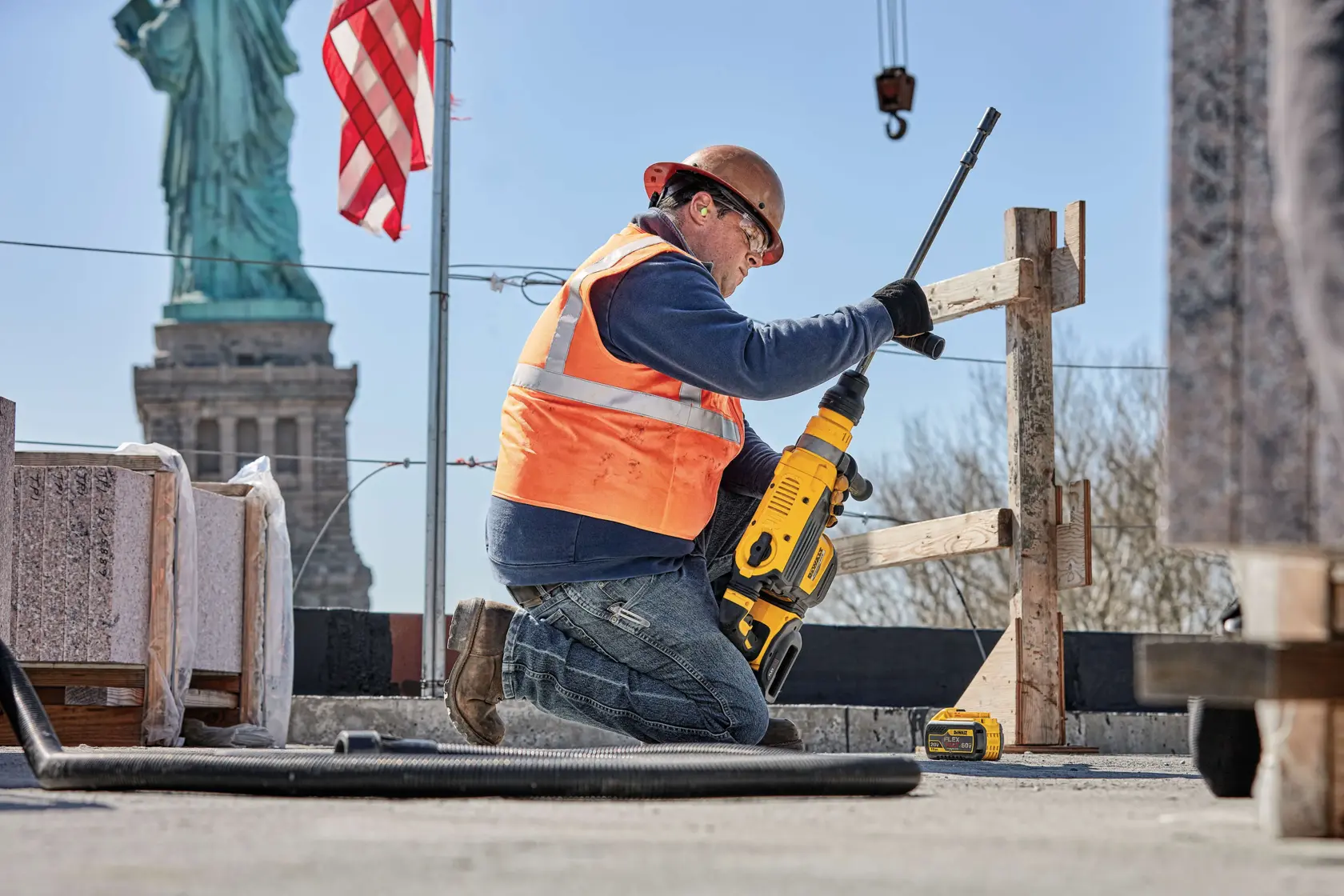 20 Volt to 60 Volt 12 AMP hours Lithium Ion Battery being replaced into a road drill by a construction worker