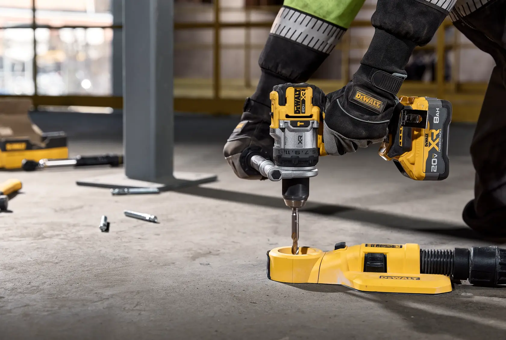 20V MAX* XR® Brushless Cordless 1/2 in. Hammer Drill drilling into concrete with dust extractor 