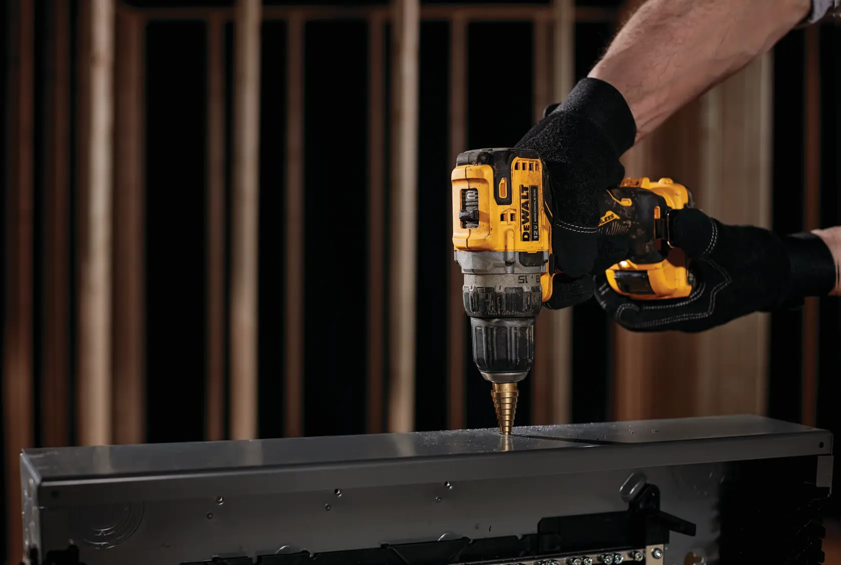 Brushless cordless drill/driver with battery in action.