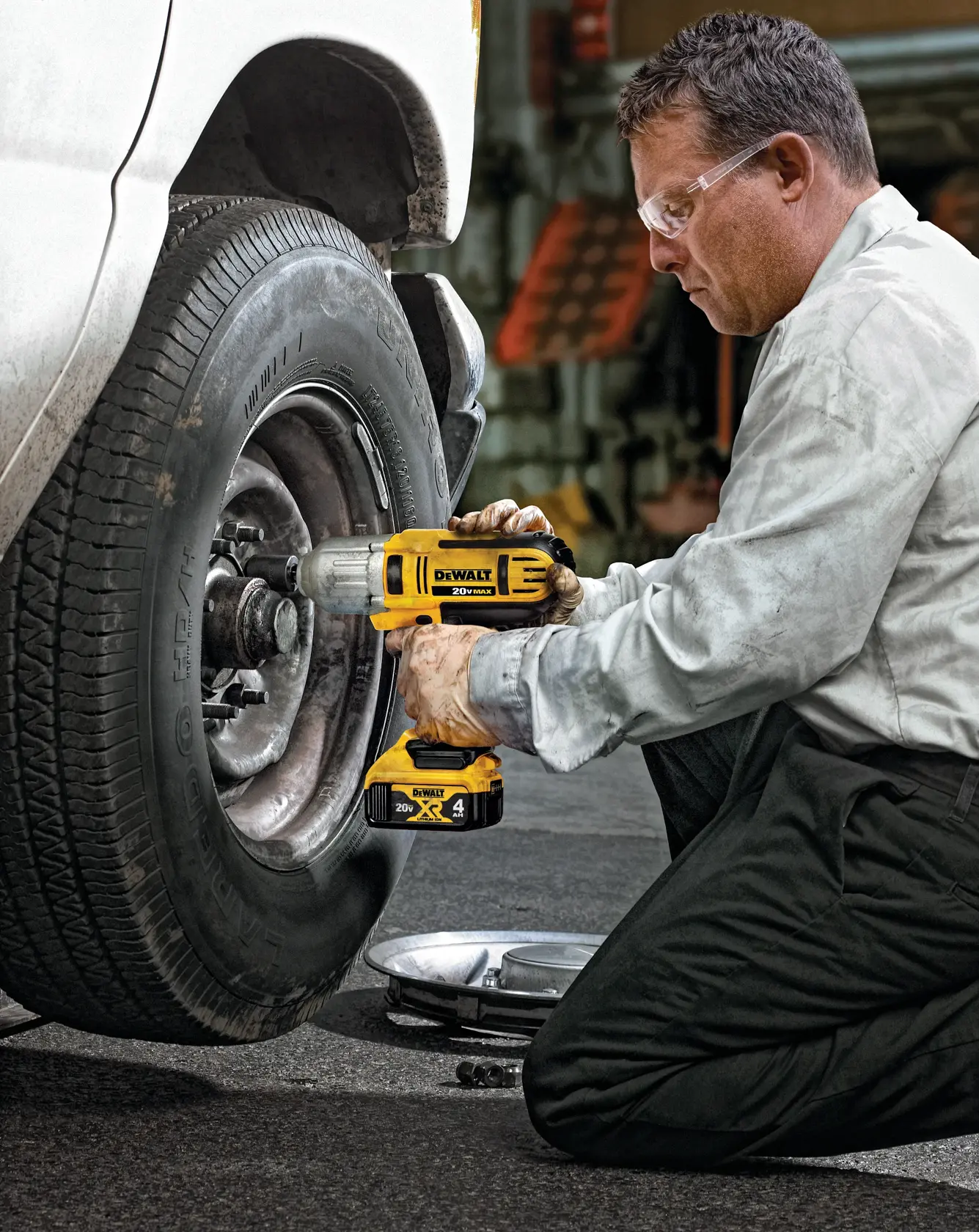 HIGH TORQUE IMPACT WRENCH being used on a car tire