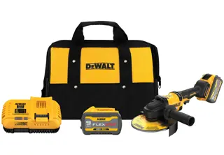 A DEWALT power tool kit including a yellow and black carrying bag, a cordless angle grinder, a FLEXVOLT lithium-ion battery, and a fast charger. All items are arranged neatly with the bag in the background.