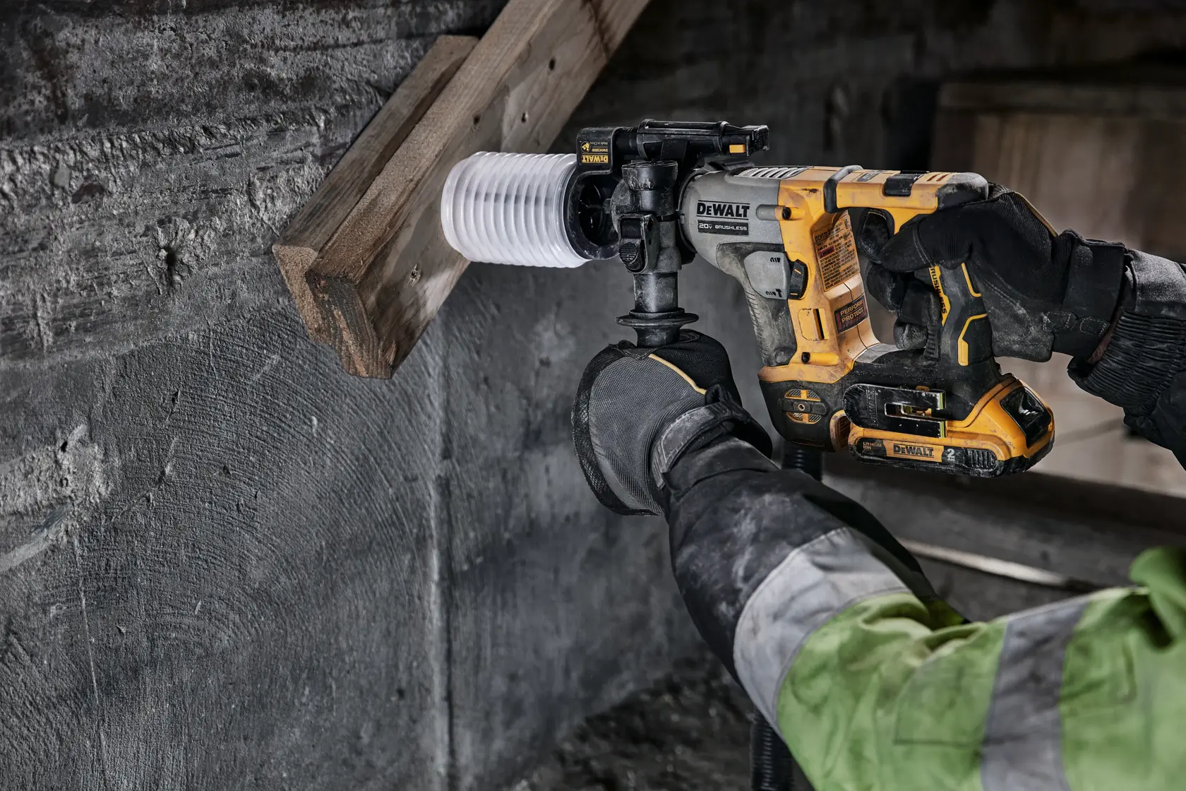 Atomic 20 volt five eighths inch brushless cordless S D S plus rotary hammer tool being used to hammer wood.
