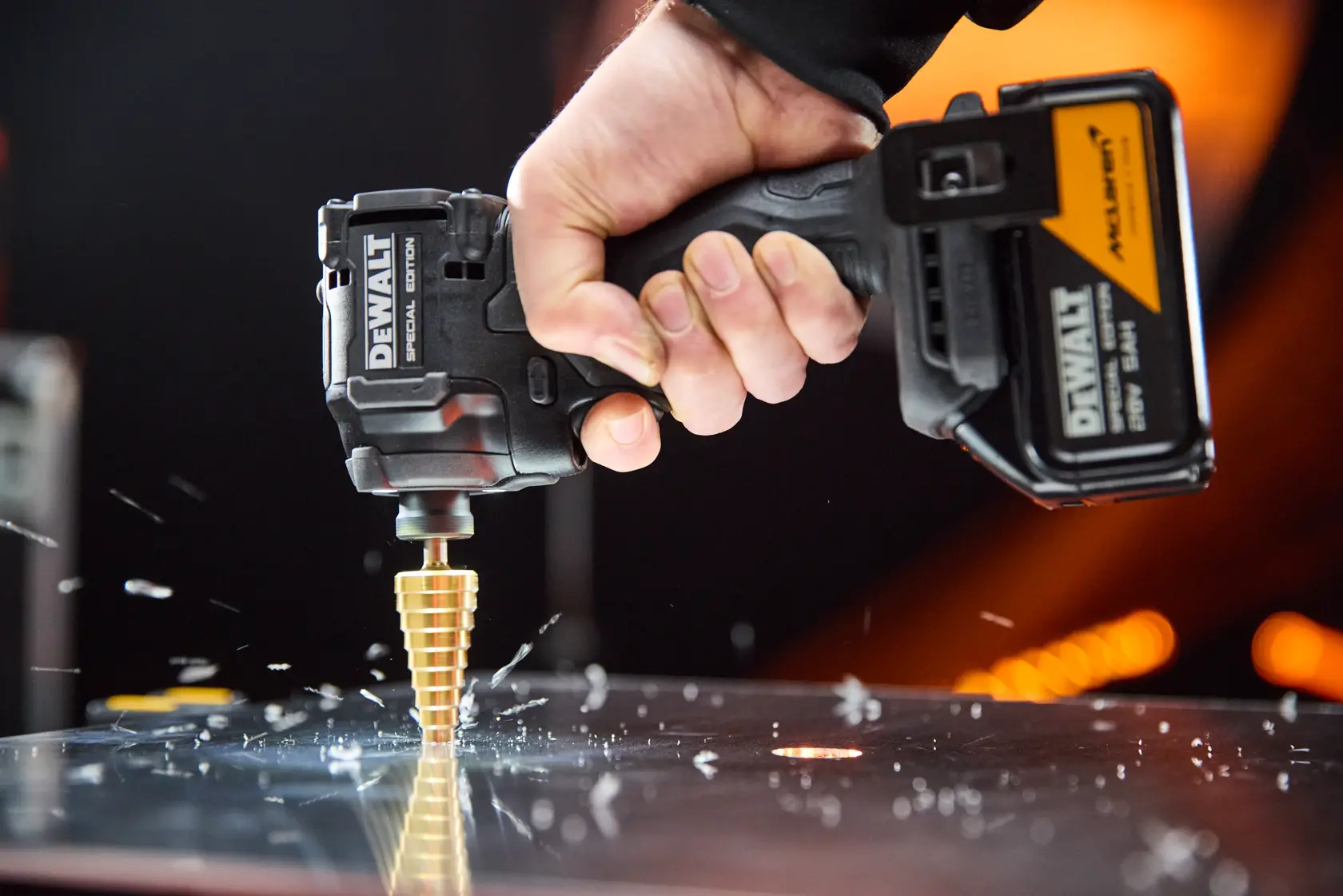 DEWALT drill in use. Photography category. SKUs: DCK2222MP2T-AR, DCK2222MP2T, DCK2222MP2T-BR, DCK2222MP2T-B2, DCK2222MP2T-B3.