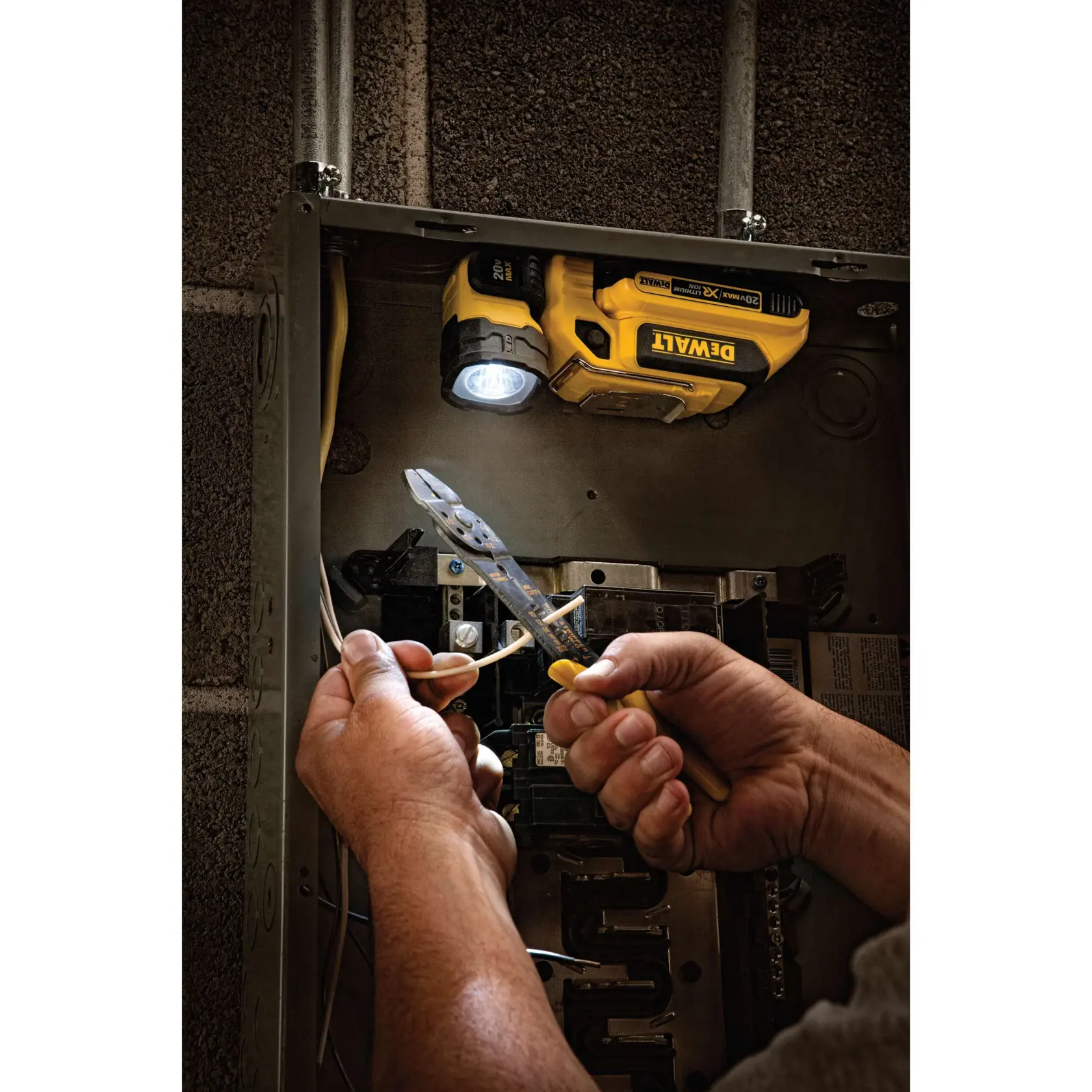 LED hand held worklight being used by a person