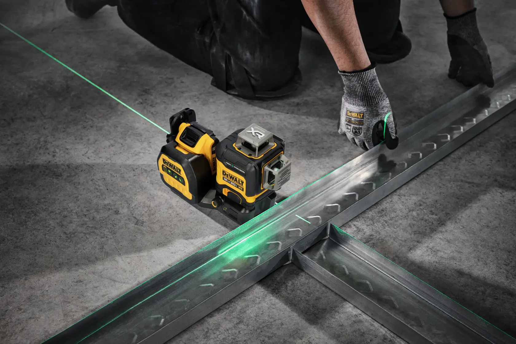 A person Using the High Precision Laser to Accurately Lay Metal Material.