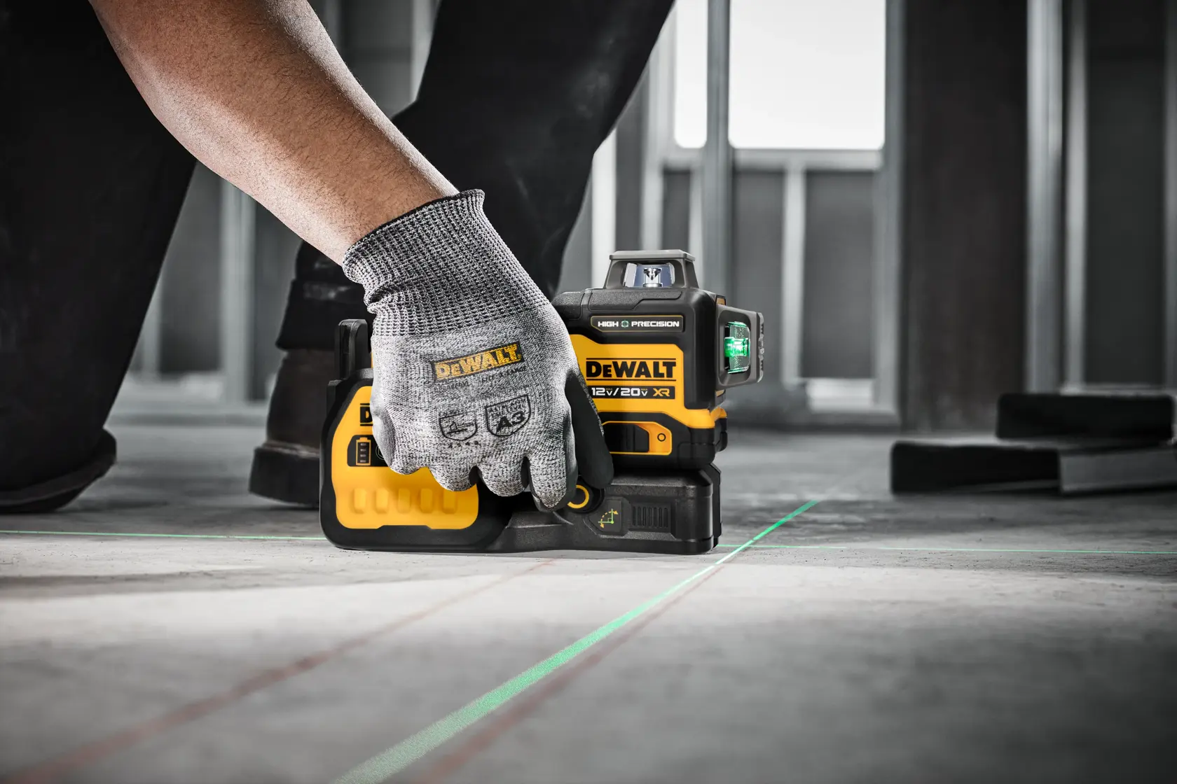 A person Using the High Precision Laser on a Floor to Measure Accuracy.