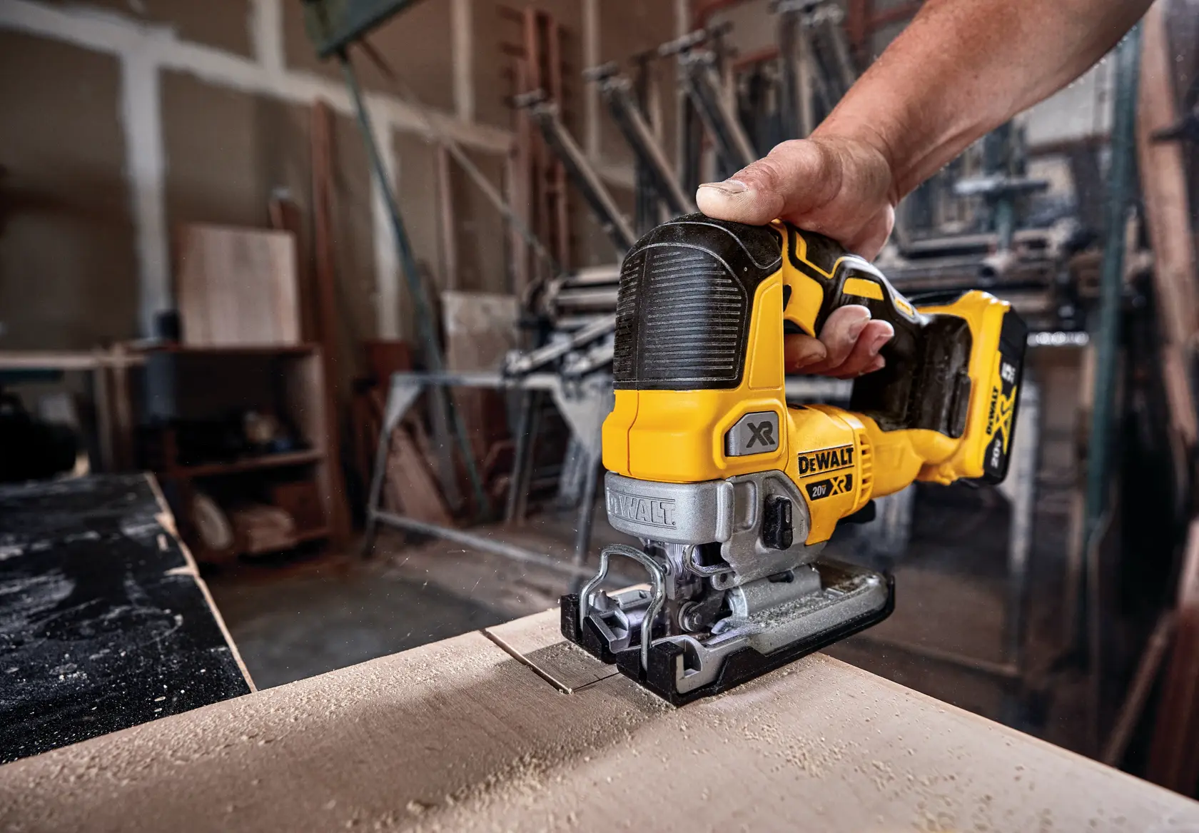 Cordless Jig Saw cutting wood.