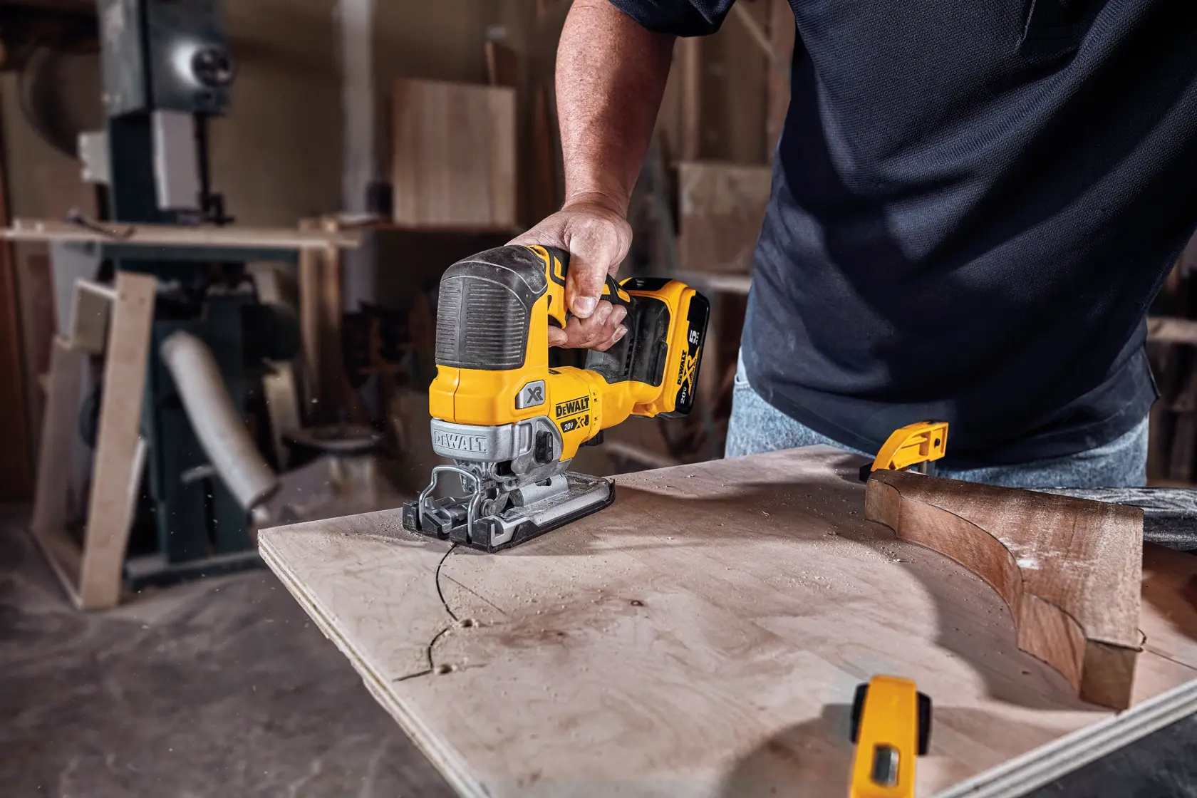Cordless Jig Saw cutting wood.