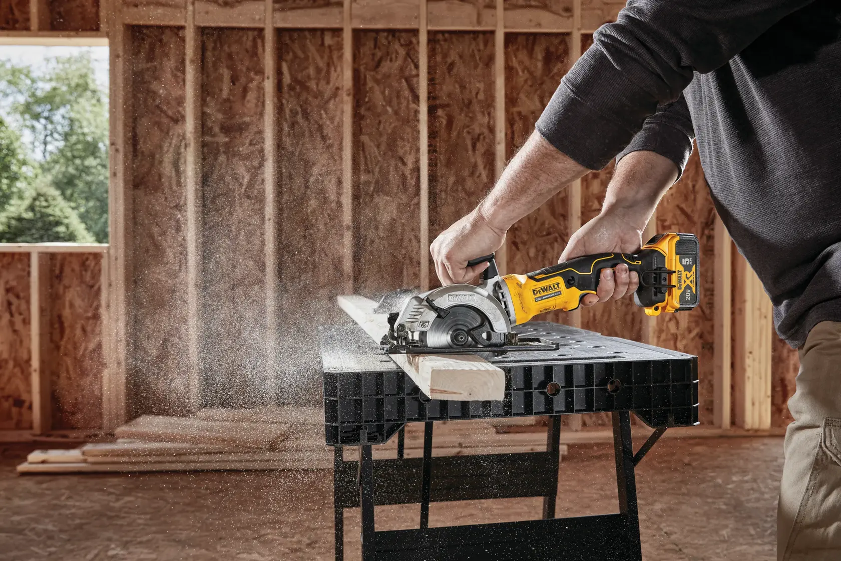 ATOMIC brushless cordless circular saw cutting wooden beam.