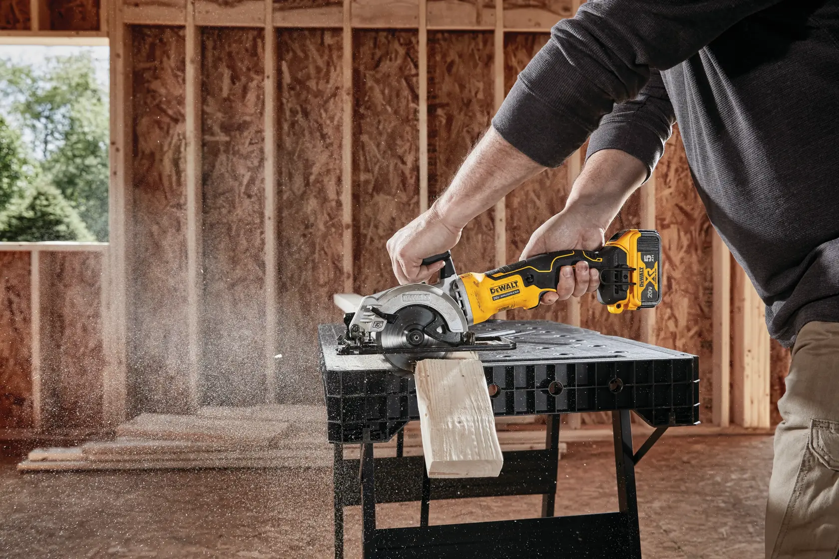 ATOMIC brushless cordless circular saw cutting wooden plank.