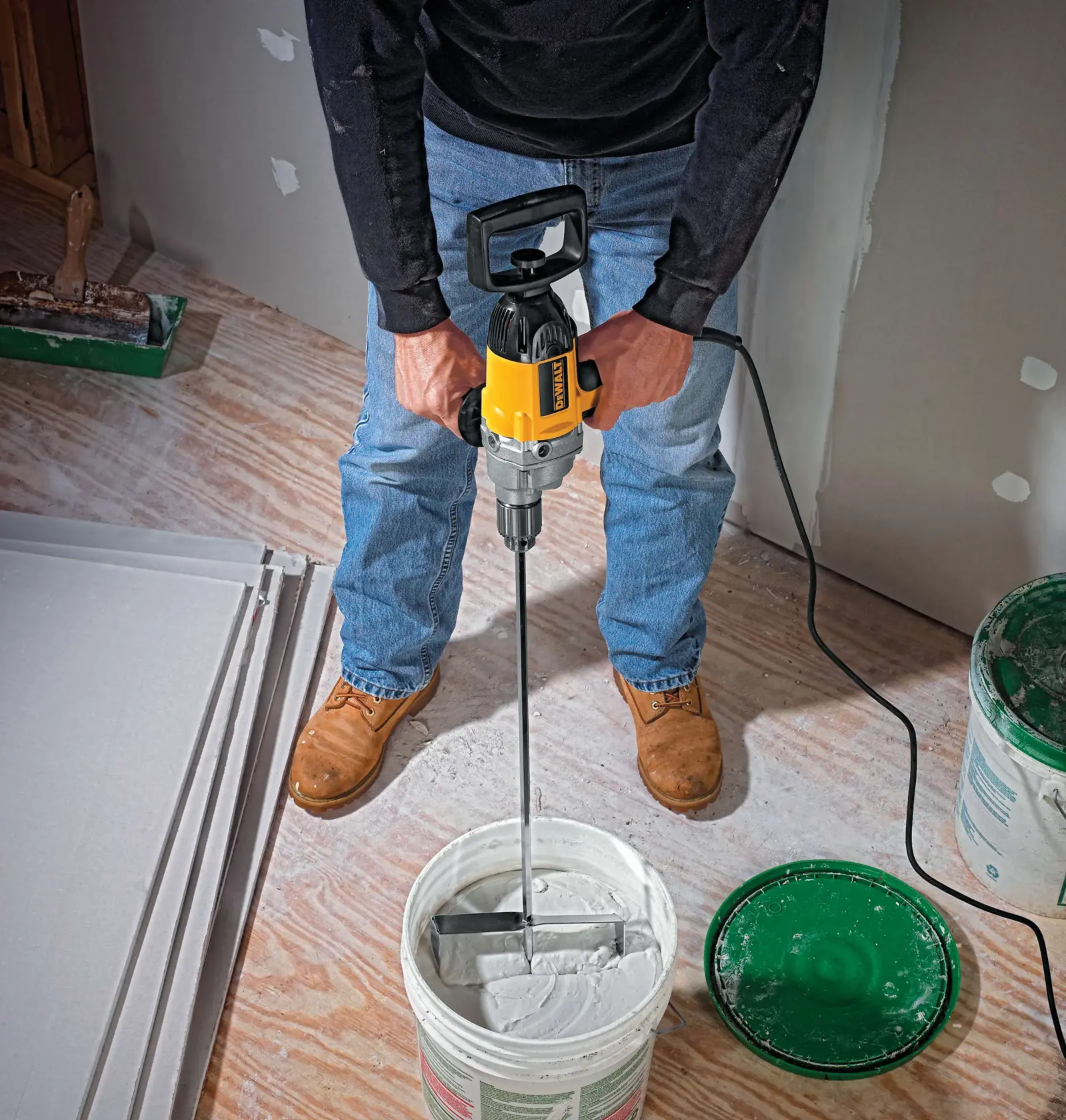 Half inch spade handle drill in action to mix concrete.