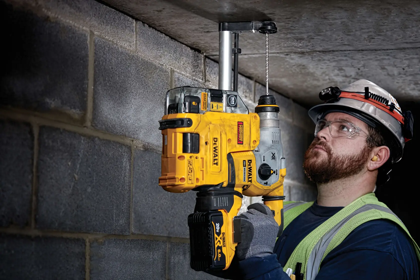 7 sixteenths inch by 4 inch by 6 inch S D S plus 2 cutter drill bits being used by a person to drill hole.