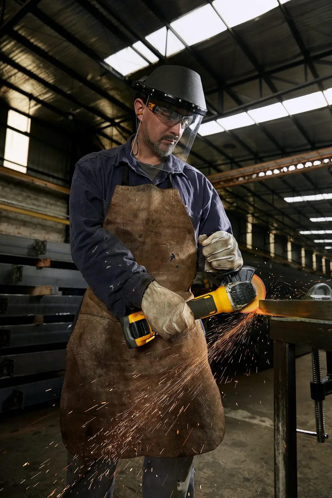 DEWALT METAL FACTORYSIDE VIEWAPPLICATION operator cutting steel profile in metallurgic plant