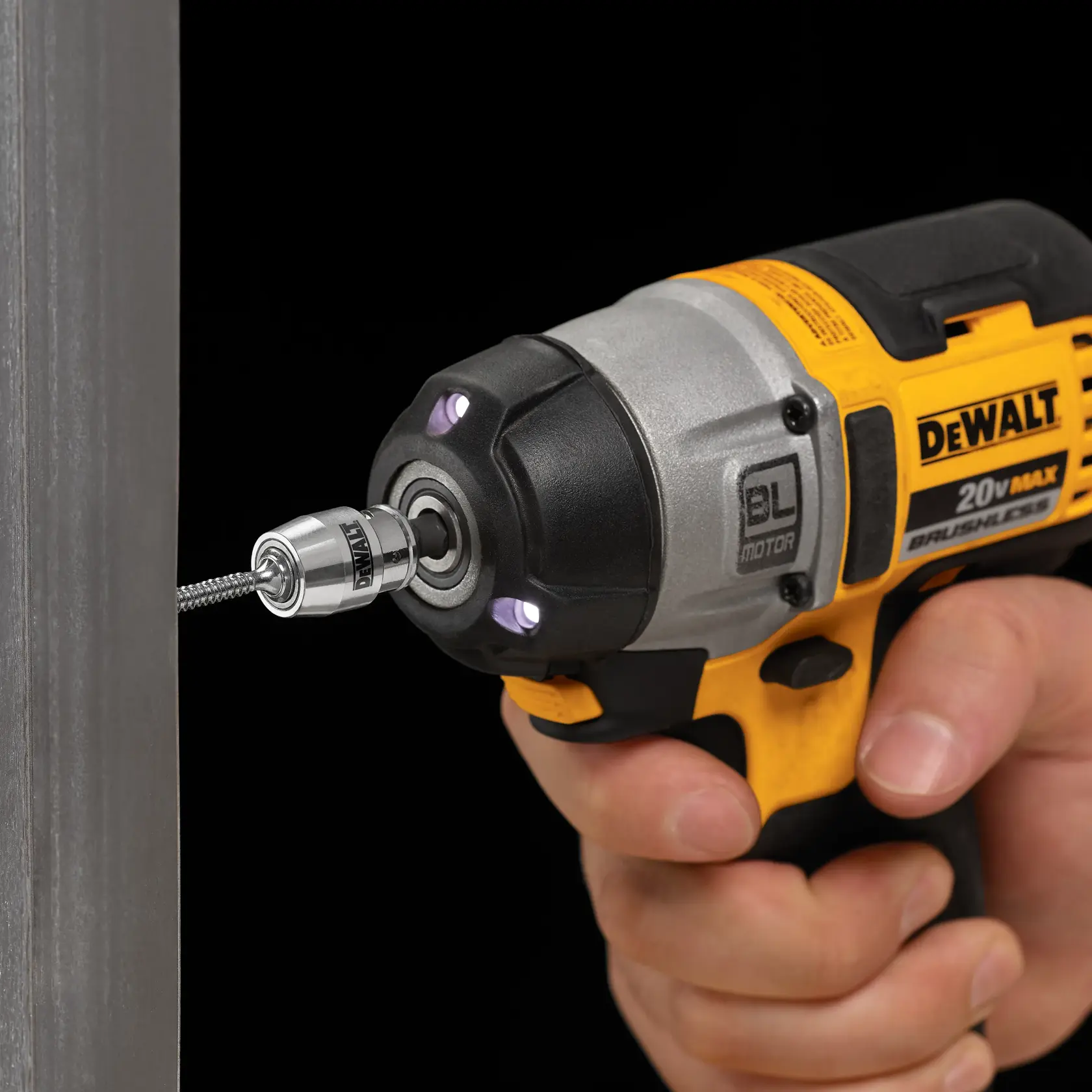 Side angle of person using DEWALT DWA2SLVIR IMPACT READY FlexTorq Screwlock Sleeve with drill/driver
