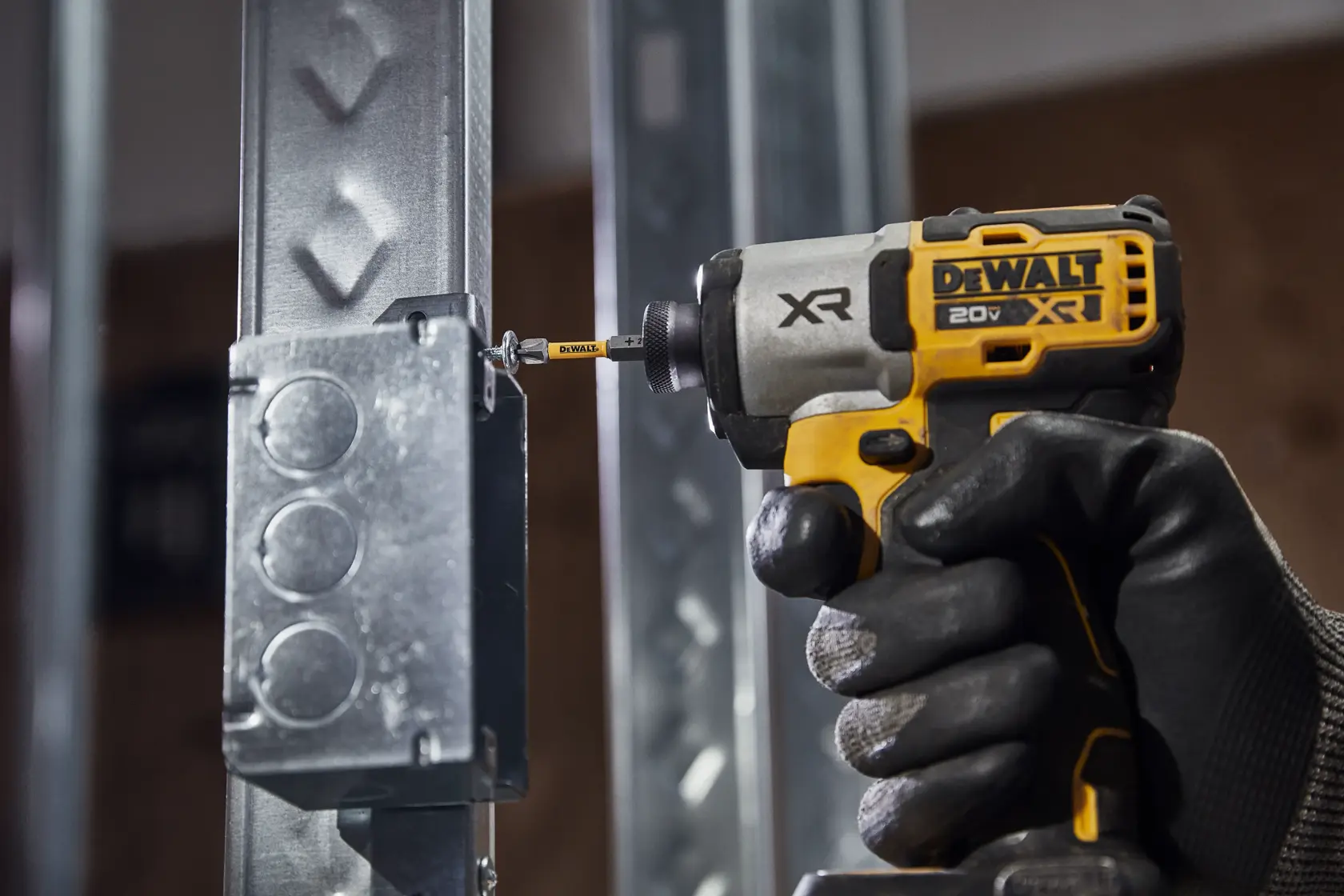 DEWALT MAXF FIT ULTRA fastening metal conduit to a metal stud with metal screws