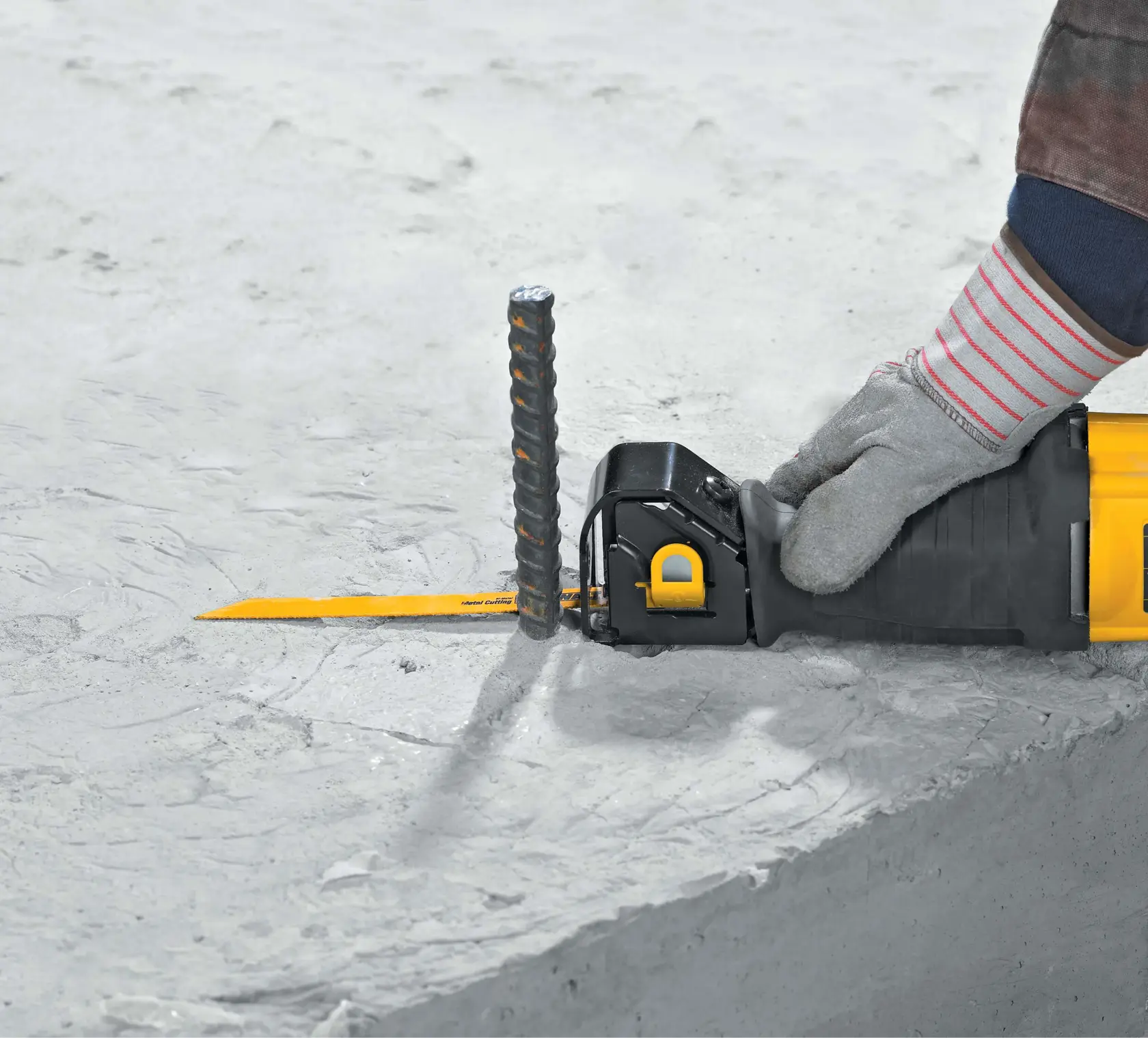 10 ampere reciprocating saw being used to cut metal.