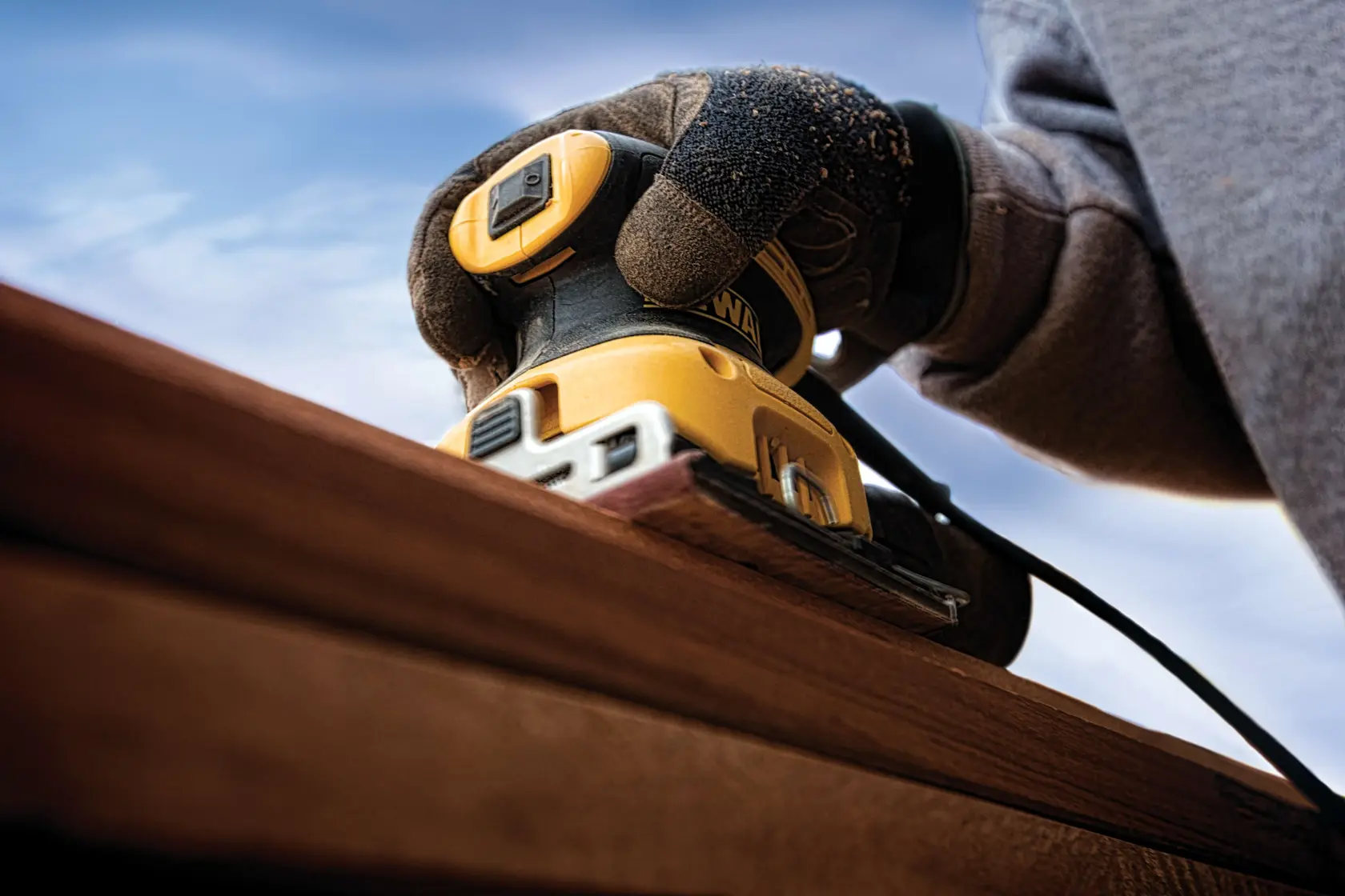 One quarter inch sheet palm grip sander sanding on wood.