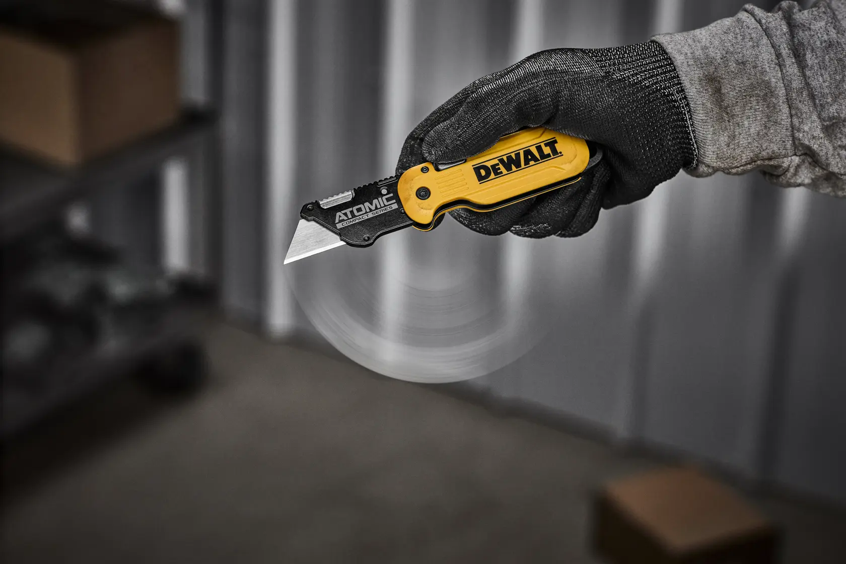 DEWALT ATOMIC knife being flipped open with one handed push to release
