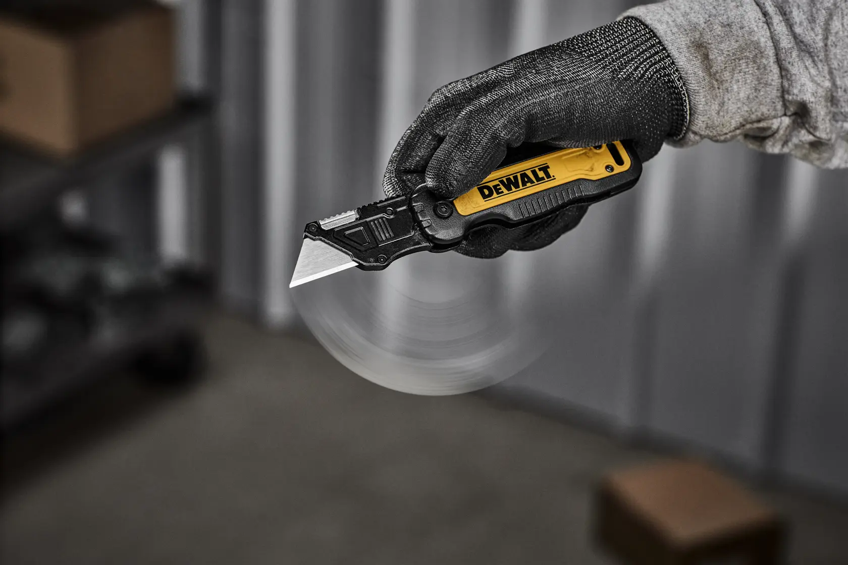 DEWALT knife being flipped open with one handed push to release