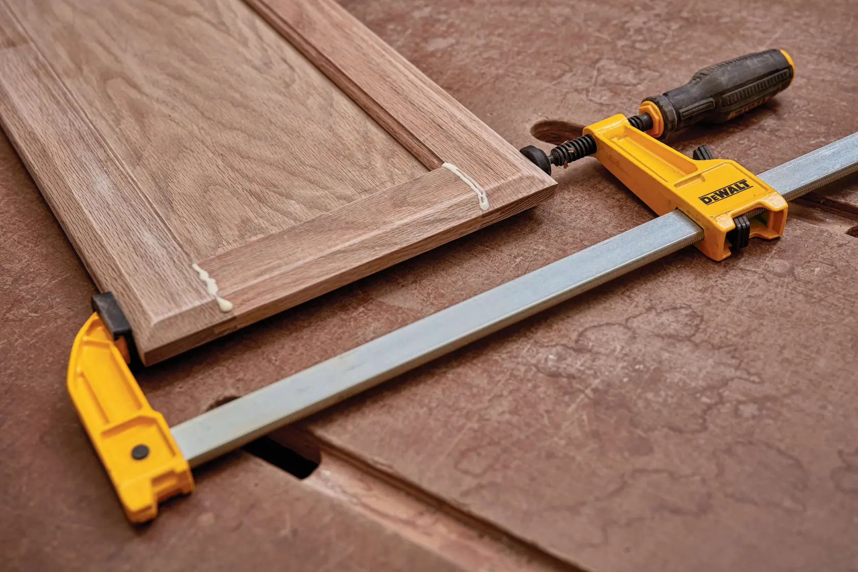 Close up of 12 inch Heavy Duty Bar Clamp being used on wooden structures.