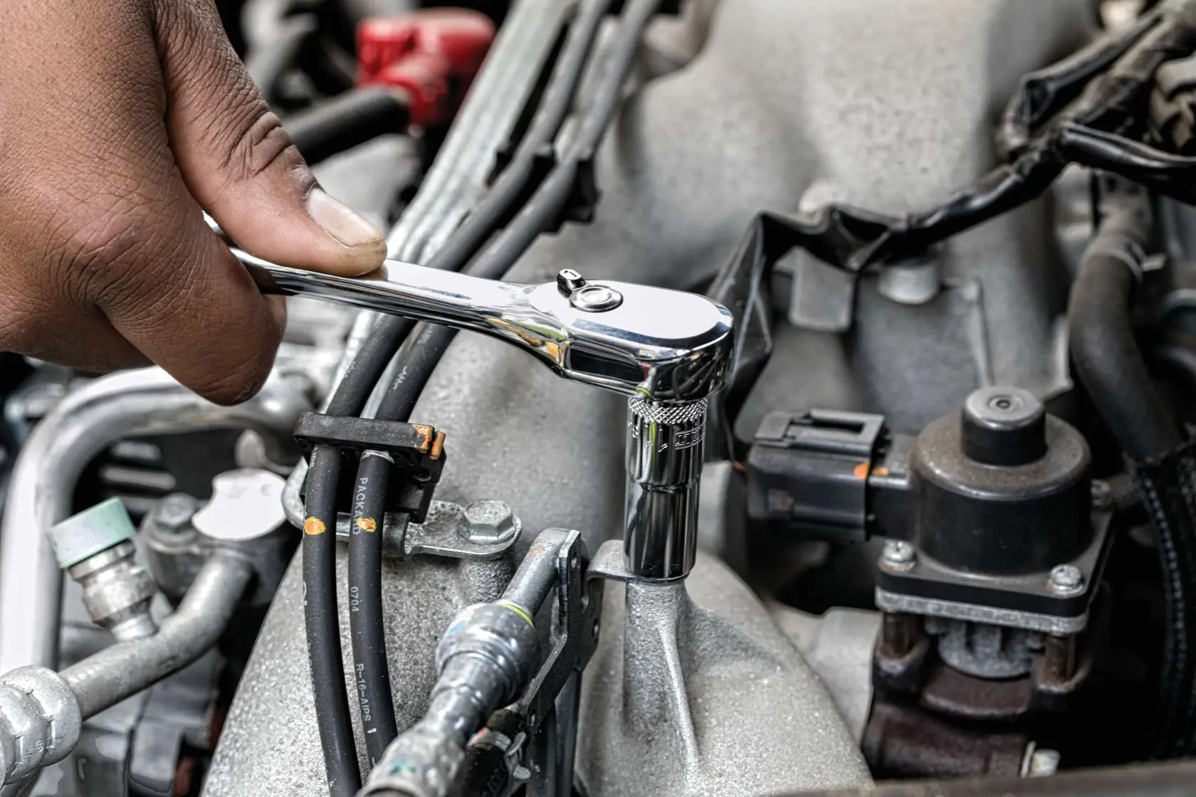 247 piece mechanics tool set being used on machinery.