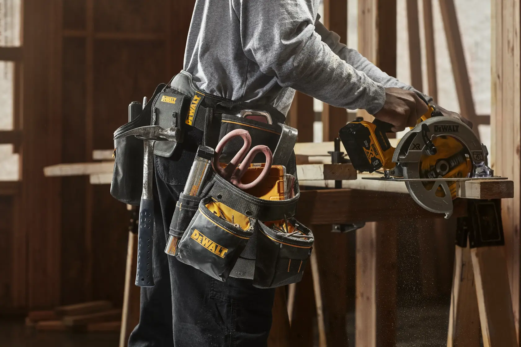 CONSTRUCTION WORKER WEARING DEWALT PROFESSIONAL IMPACT DRILL HOLSTER