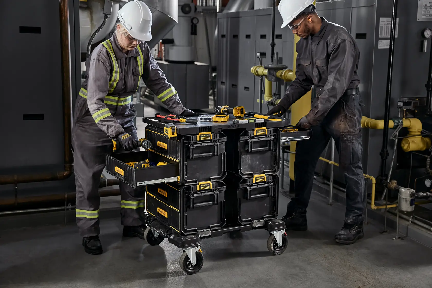 2 people working around a TOUGHSYSTEM 2.0 tower in an MRO enviornment